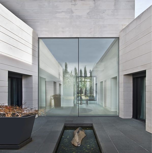 glidline gs 15 sliding door in a stone and marble opening