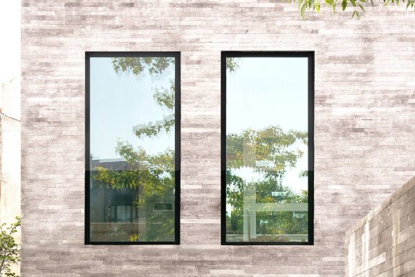 cortizo cor 70 windows in a sstone rendered setting, showing two fixed windows.