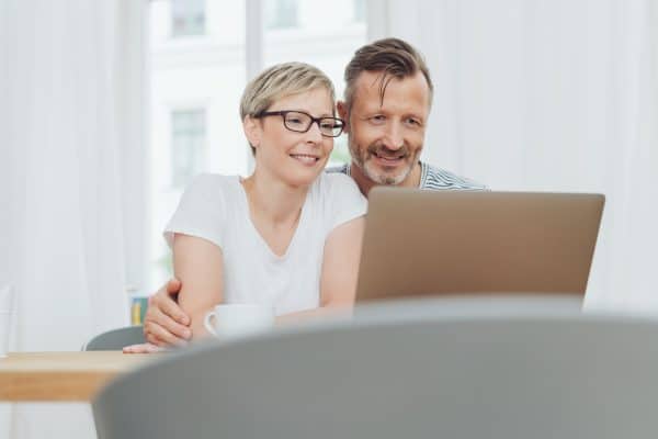 picture of couple with laptop buying windows and doors online