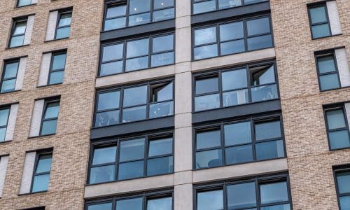 high rise apartment building showing tilt and turn windows in both opening positions