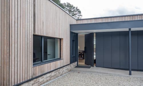 outside view of cortizo tilt and turn window in wood cladding