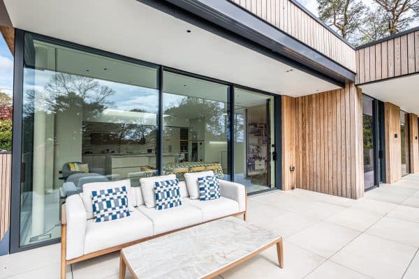 outside view of sliding doors with garden furniture and terrace