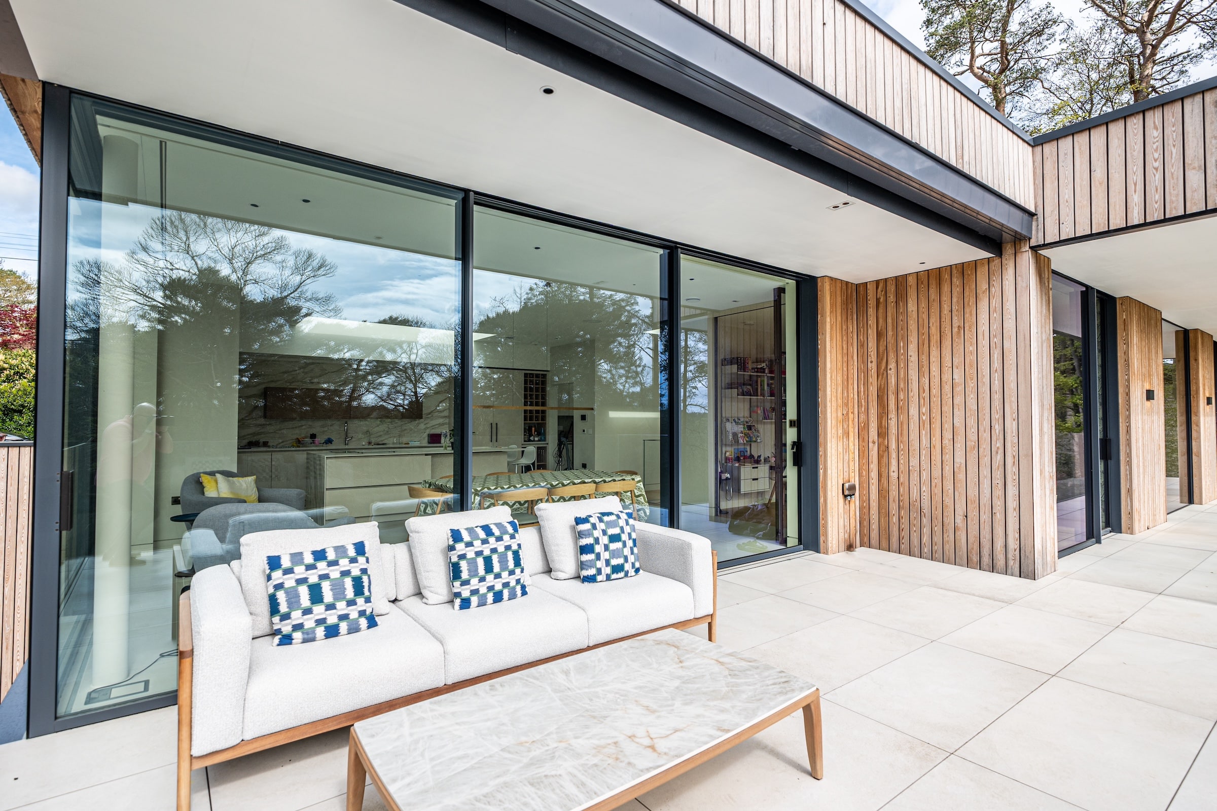 outside view of sliding doors with garden furniture and terrace