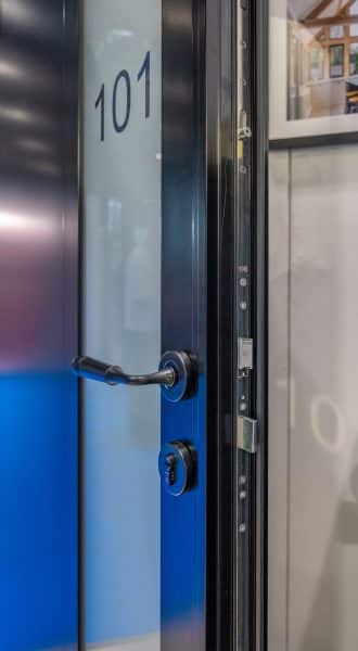 picture of partially open front door with handle and lock