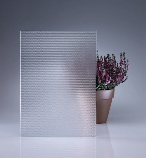 picture of glass sample with plant behind to gauge obscurity