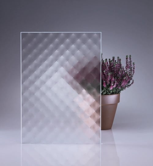 picture of glass sample with plant behind to gauge obscurity