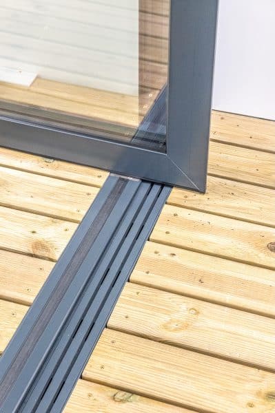 picture of pivot door frame and low track threshold