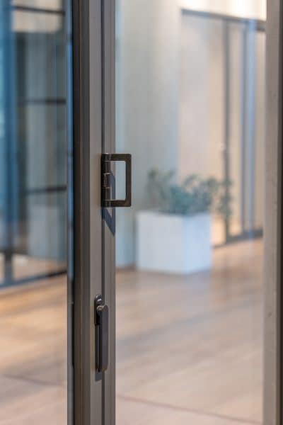 close up of essential hardware frameless bifold doors need