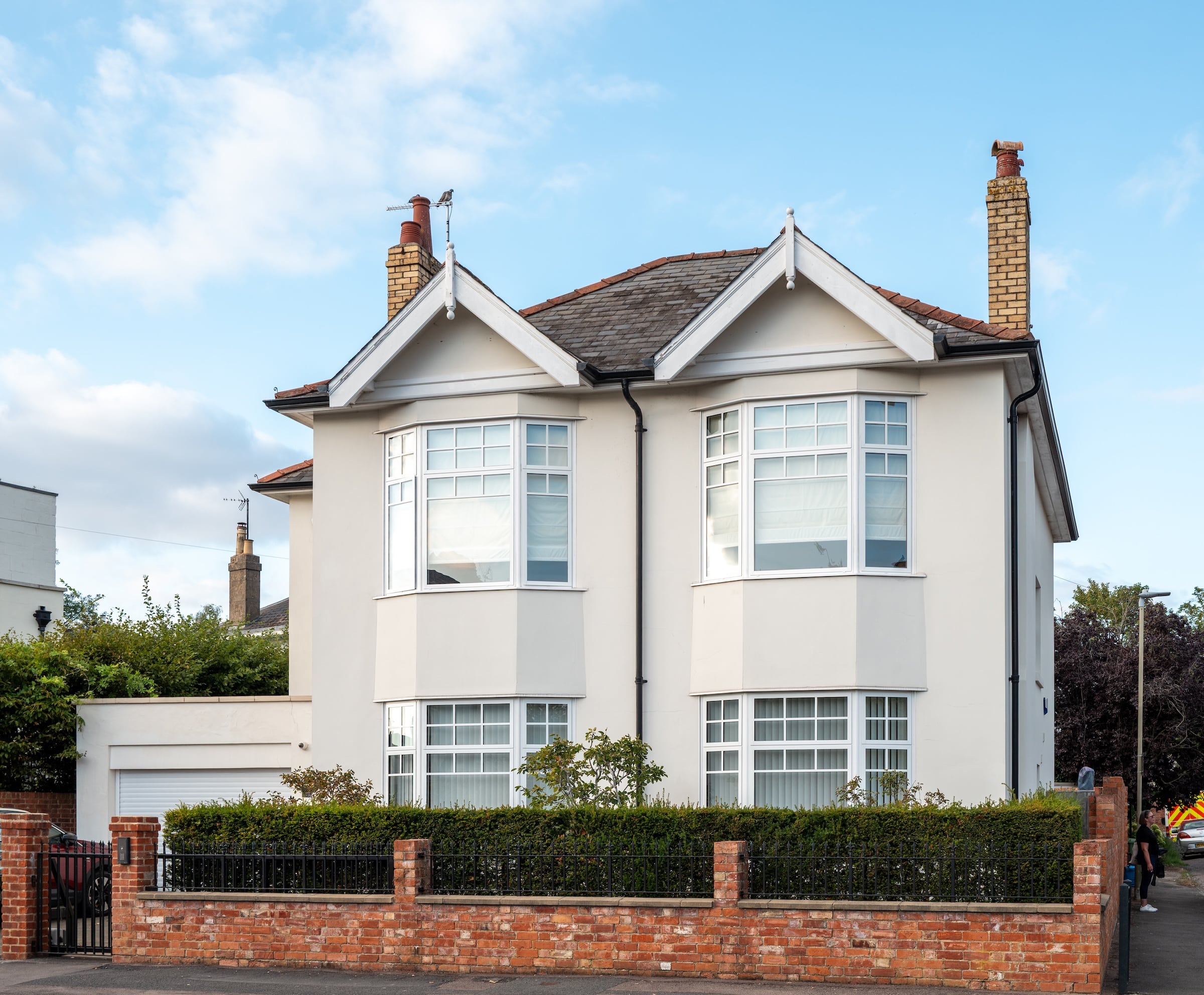 exlabesa kc51 windows in a double gable house in white with bars on the glass