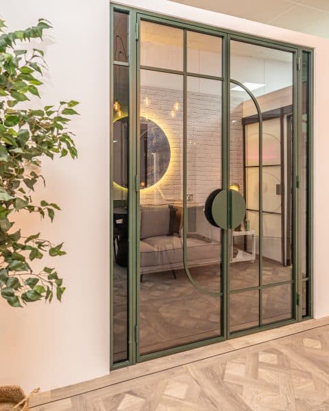 picture of otif steel doors in a showroom green art deco