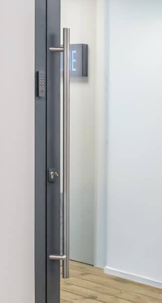 outside view of gpd80 pivot door showing smart lock keypad and pull handle