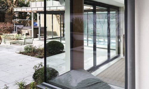 frameless corner window with patio views