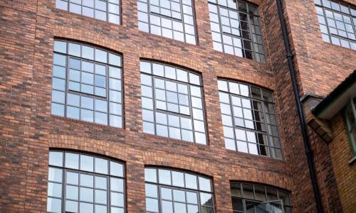 pivot opening aluminium windows in a london loft building