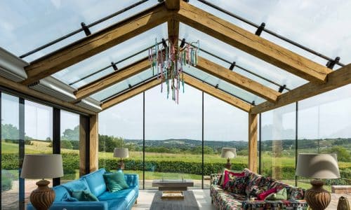 frameless glass roof in a gable design with oak supports
