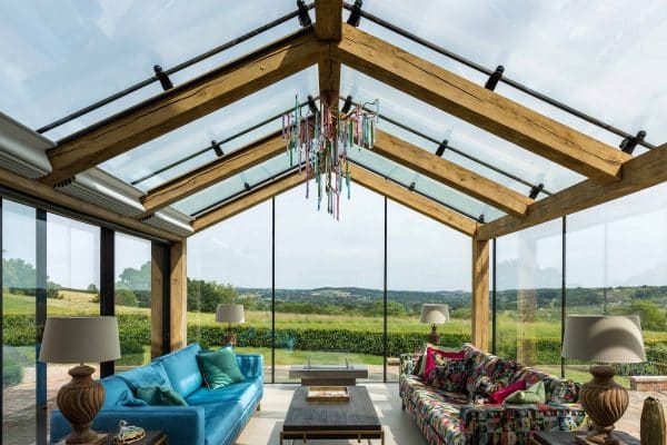frameless glass roof in a gable design with oak supports