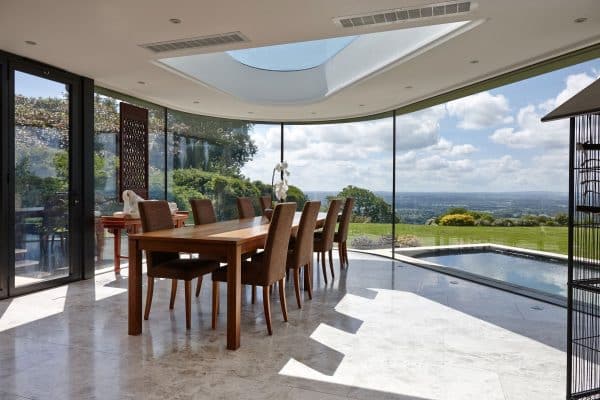 frameless windows in a coastal location with curved glass